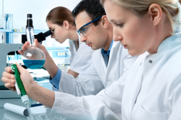 a group of people working in a lab.